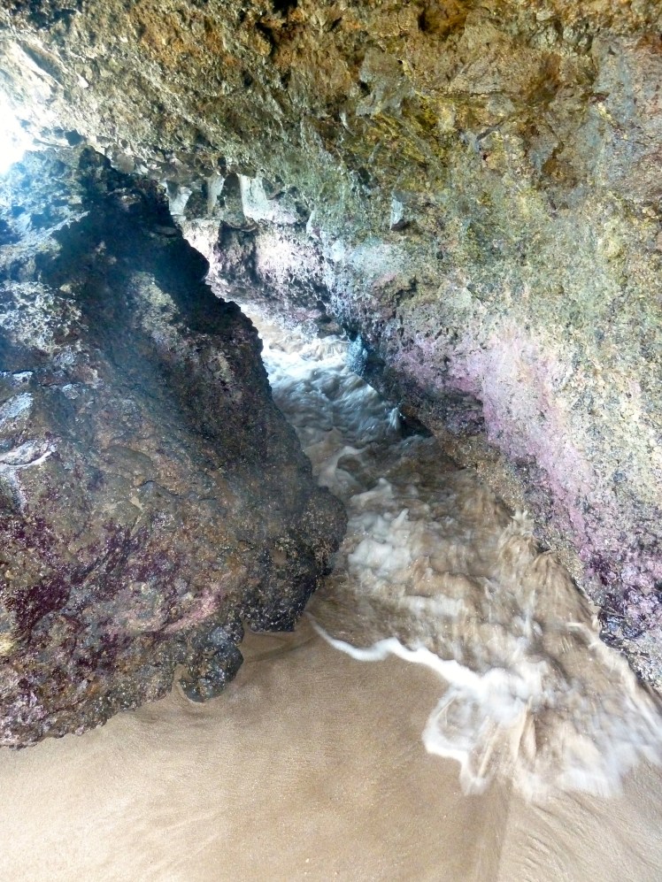 Watching the waves crashing into the caves